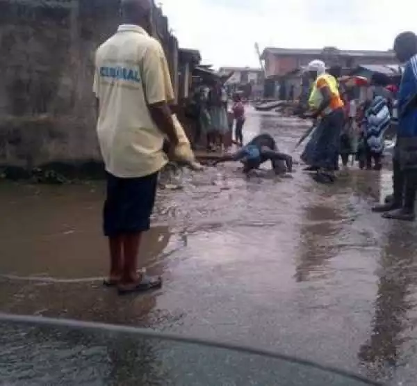 Photo: Child Rescued After Being Washed Into Canal In Lagos